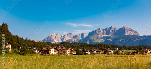Fototapeta Alpine summer view with Mount Wilder Kaiser in the background at Oberndorf in Tirol, Kitzbuehel, Tyrol, Austria