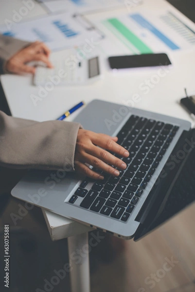 Fototapeta Portrait of young Hispanic professional business woman standing in office. Happy female company executive, smiling businesswoman entrepreneur corporate leader manager looking at camera using tablet