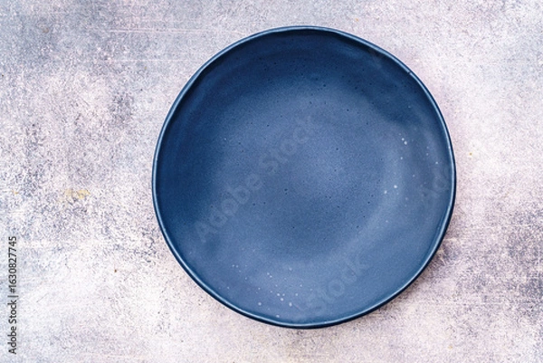 Obraz Empty blue plate on concrete