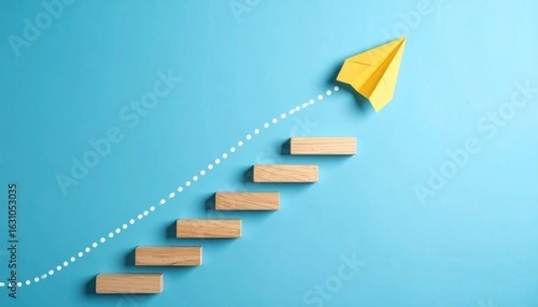 Fototapeta Conceptual Staircase to Success: Paper Airplane Ascending on Wooden Blocks, Symbolizing Growth, Achievement, and the Path to Ambition
