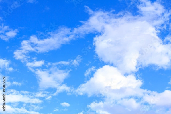 Obraz Blue sky background with white clouds on sunny summer or spring day.