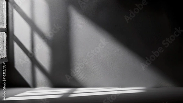 Fototapeta Moody dark surface with natural light shadows from a window. Great for bold, modern layouts.