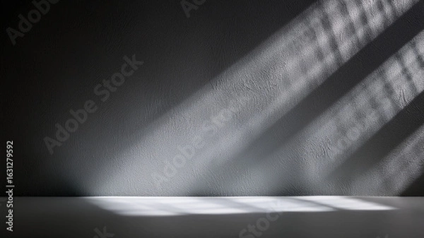 Fototapeta Close-up of soft gray surface with natural light shadow patterns. Elegant and clean background.