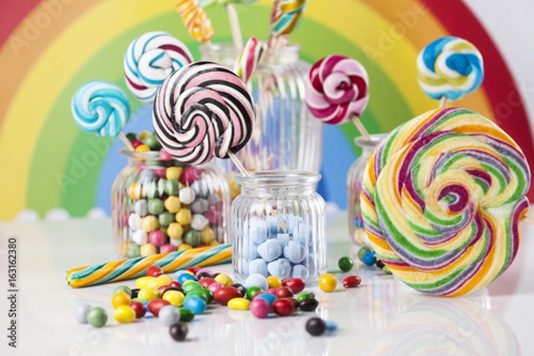 Fototapeta Colorful lollipops and different colored round candy and gum balls