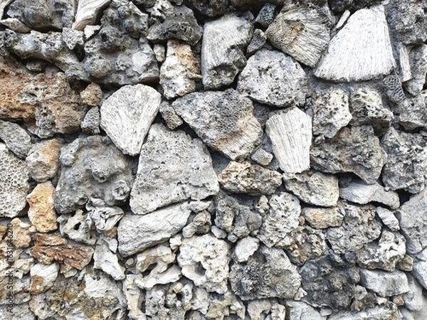 Fototapeta Broken coral pieces set in rough texture mosaic pattern abstract natural background texture