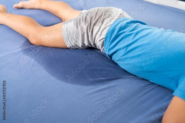 Fototapeta Pee on a bed mattress,Bed Wetting sleep enuresis in child, baby concept ,selected focus at wet on the bed sheet