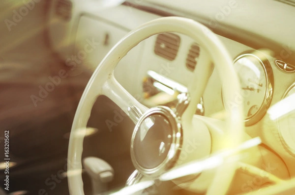 Fototapeta Console of vintage car with sun light.