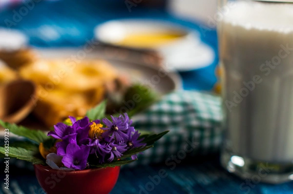 Obraz pancakes with honey syrup on a white plate. traditional crepe for pancake week or Shrovetide. crepes with roasted nuts