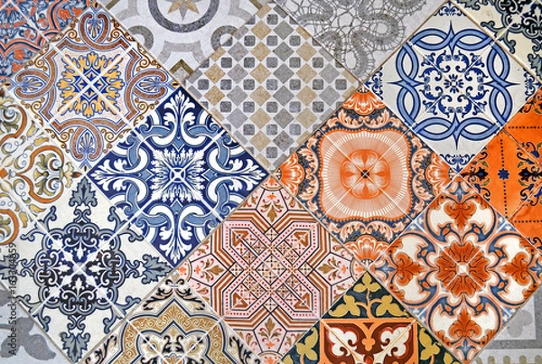 Fototapeta Detail of ornamental ceramic tile with colorful patchwork.