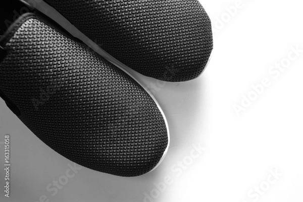 Fototapeta Shoes background / A shoe is an item of footwear intended to protect and comfort the human foot while the wearer is doing various activities