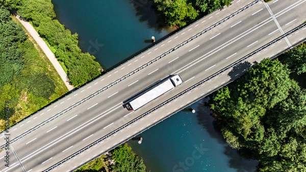 Fototapeta Bridge over canal with truck aerial drone view, dutch landscape, transportation concept, the Netherlands