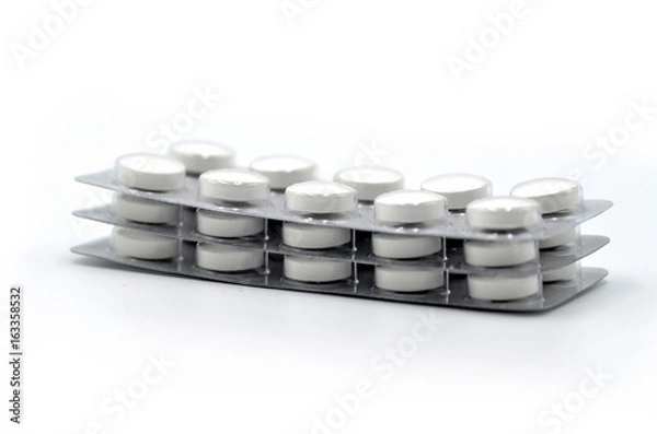 Obraz Medicine tablets on white background