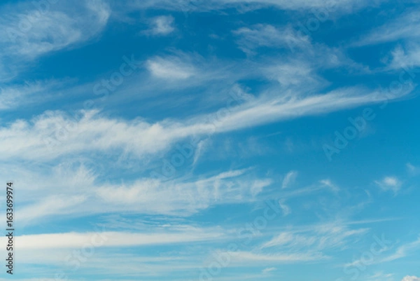 Obraz Thin clouds crossing a deep blue sky