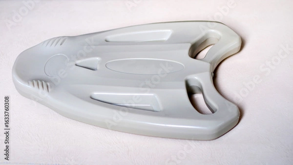 Obraz Plastic float board to help practice swimming.