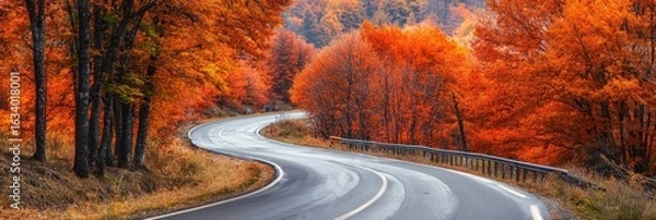 Fototapeta autumn road landscape in beautiful nature travel. autumn colors in mountain road scenery. autumn landscape on the highway in colorful forest. nature trip in fall. highway landscape on fall season.