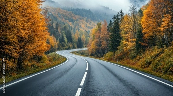 Fototapeta autumn road landscape in beautiful nature travel. autumn colors in mountain road scenery. autumn landscape on the highway in colorful forest. nature trip in fall. highway landscape on fall season.