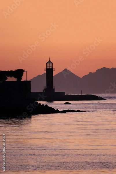 Fototapeta Vigo Lighthouse with the Cies Islands in the background at sunset