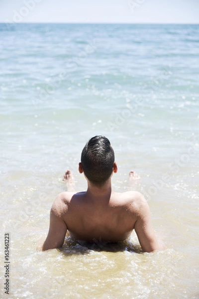 Obraz young man on the beach