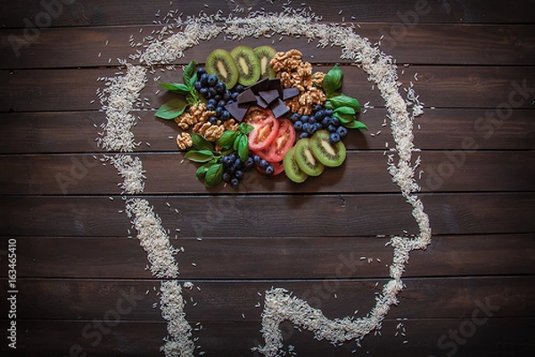 Fototapeta Some nuts, blueberries, dark chocolate, kiwi and tomatoes that are healthy foods for you body and your brain.