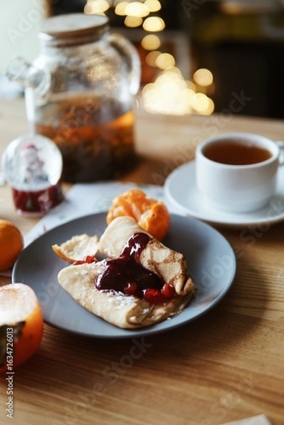 Fototapeta Festive and everyday meals: from waffles and pancakes with jam to salmon, salads, baked chicken, and takeaway food. Seasonal table settings and healthy food in catering or home-style presentation.