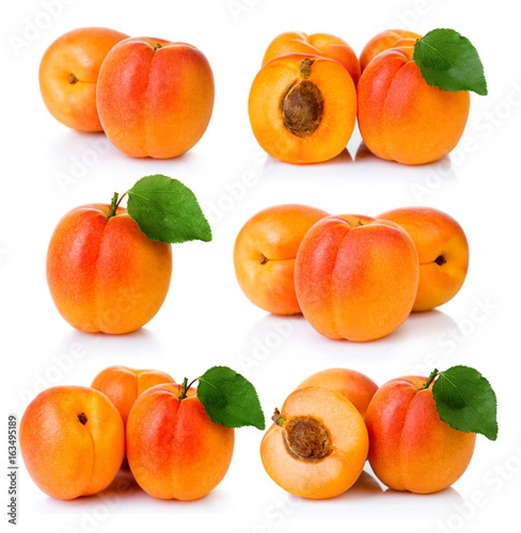 Obraz Set of ripe apricot fruits with with green leaf and slice isolated on white