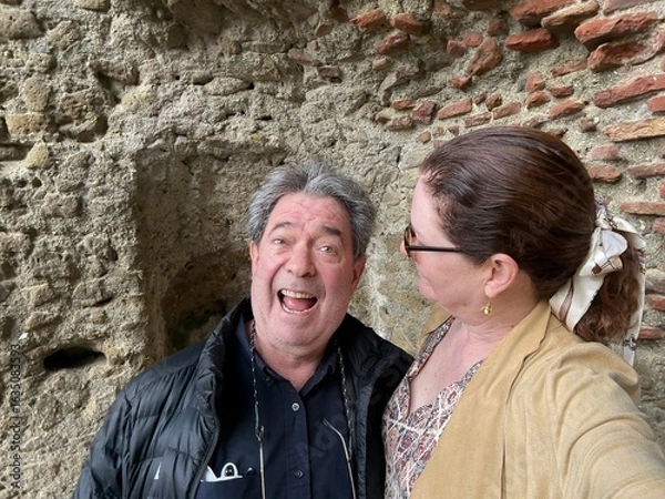 Fototapeta Candid Outdoor Portrait of a Happy Couple on Holiday