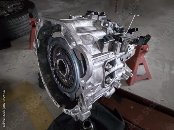 Obraz car transmission assembly being repaired, automatic transmission casing