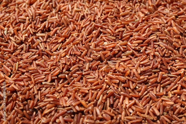 Obraz Raw brown rice as background, closeup