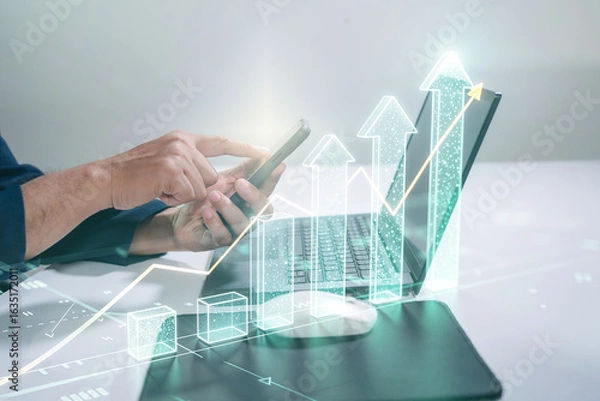 Fototapeta chart, diagram, graph, invest, investor, management, statistic, risk, analyzing. A man is typing on a laptop with a graph of a stock market on the screen.business growth concept.