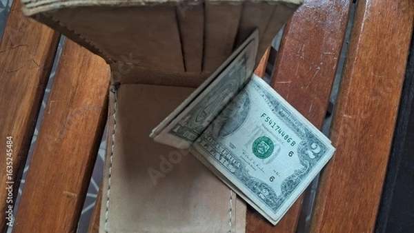 Obraz Elegant leather wallet with dollar bills inside