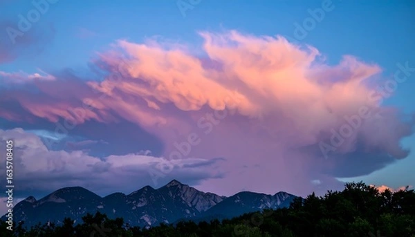 Fototapeta Sunset clouds over mountain range