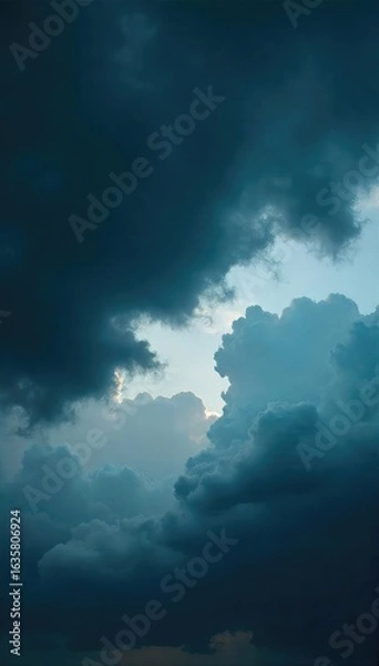 Fototapeta A brooding, overcast sky hangs heavy with dark, ominous clouds, creating a dramatic, moody atmosphere Perfect for illustrating themes of mystery, suspense, or impending storm , stormy, climate, moody