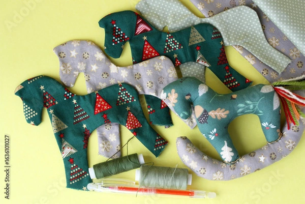 Fototapeta A lot of handmade textile toy in the shape of a small horse. Handmade Tilda toy.