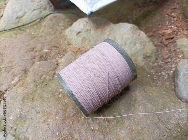 Fototapeta kite string reel for children's toys.