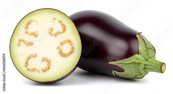 Fototapeta Fresh eggplant cut in half showing seeds and texture