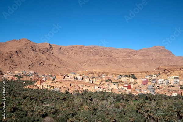 Fototapeta Tinghir oasis, panoramic view on the city and the large area with palm trees. Morocco, North Africa
