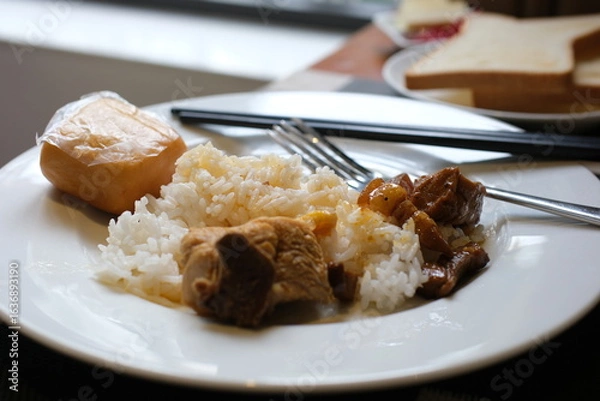 Obraz Tso's chicken with rice, onions and broccoli on the table. horizontal view from above . High quality photo