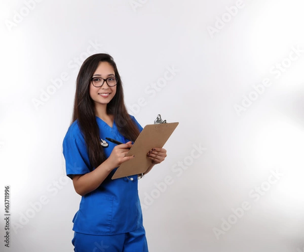 Fototapeta Young Nurse Takes Notes