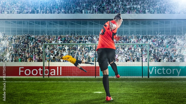 Obraz piłkarz bierze karę na zatłoczonym stadionie