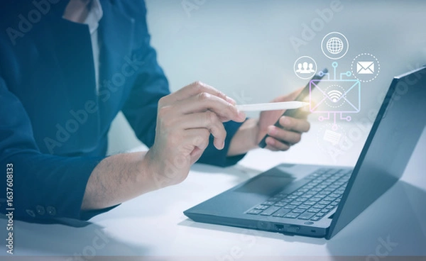 Fototapeta Businessman hand working with modern computer and smart phone ,Global internet connection concept. Internet usage worldwide in business and technology with internet icons linked.