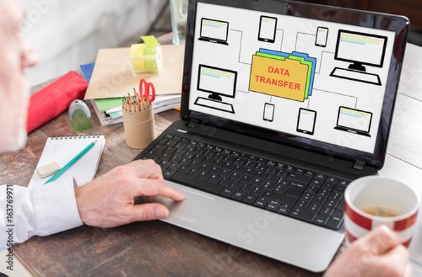 Fototapeta Data transfer concept on a laptop screen