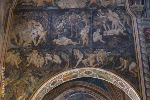 Fototapeta Detail of fresco of Inferno by Taddeo di Bartolo in Collegiata di Santa Maria Assunta, San Gimignano, Italy, depicting Hell and punishments for sins.
