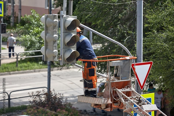 Obraz Installation of a traffic light on a lift
