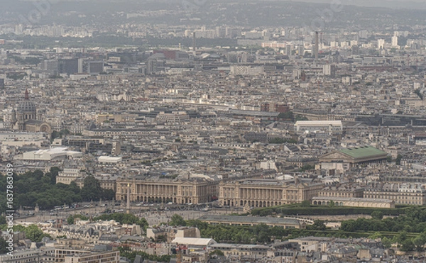 Fototapeta Aerial perspective of Paris, featuring iconic landmarks and the cityscape stretching into the distance