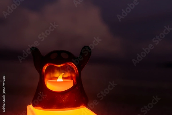 Fototapeta Concept: Halloween beach and ocean background with sea ghost with witch ghost fire, dark, scary tone.