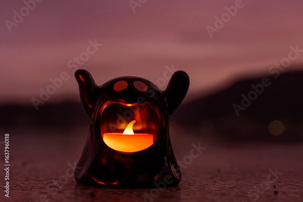 Fototapeta Concept: Halloween beach and ocean background with sea ghost with witch ghost fire, dark, scary tone.