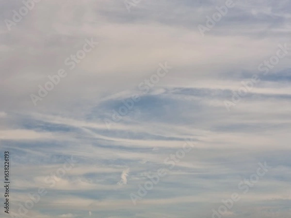 Fototapeta Serene Sky with Soft Clouds
