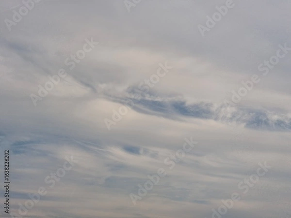 Fototapeta Serene Sky with Soft Clouds