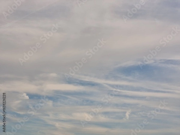 Fototapeta Serene Sky with Soft Clouds