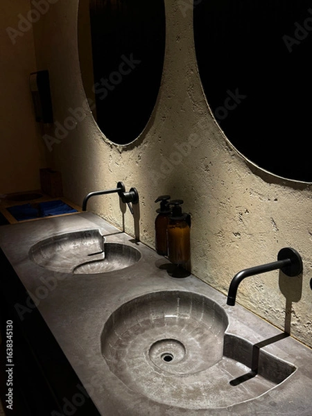 Fototapeta Artificial stone sinks shaped like nautilus shells. Public space design concept. Handheld mobile photo, selective focus, non AI